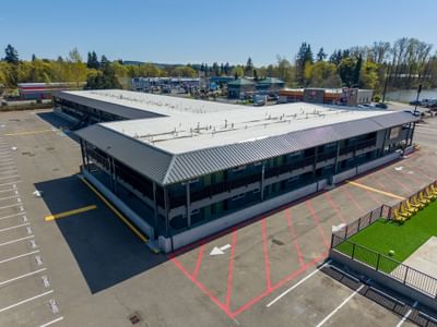 High-angle view of the parking lot and grey exterior architecture of The Varsity South