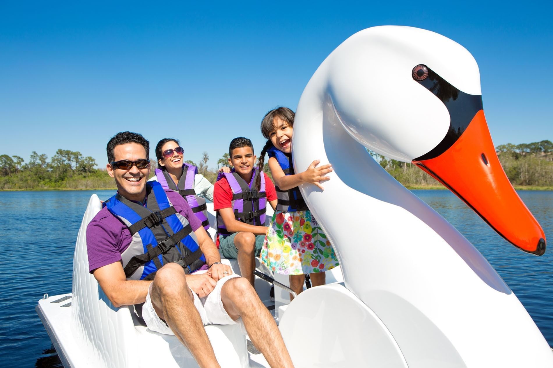 Family enjoying a Swan Boat ride at The Grove Resort and Water Park