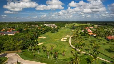 Aerial view of La Estancia Golf & Country Club surrounded by lush greenery near The Hub Acunmeyda
