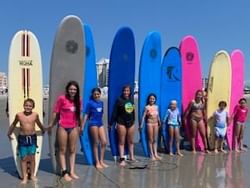 Kids pose with their surfboards after a lesson near our beachfront hotel in Cape May