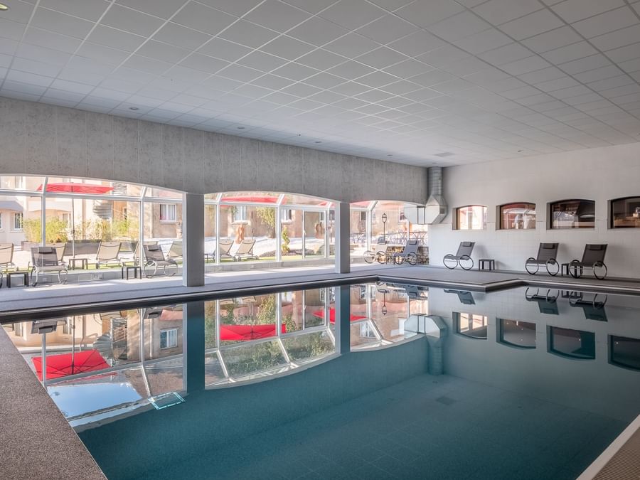 Indoor pool in Hotel Causse Comtal at The Originals Hotels