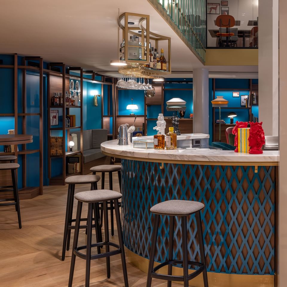 Interior view of bar counter area with high chairs at Portico84