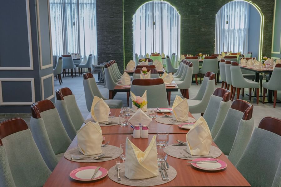 Elegant dining area with set tables and chairs at Warwick Hotel & Spa - Jeddah.