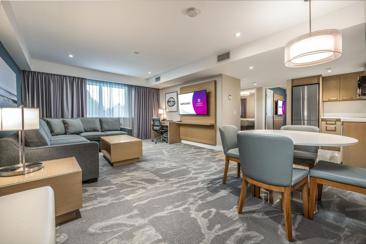 Living room and dining area in Coast Premium Two Bedroom Suite