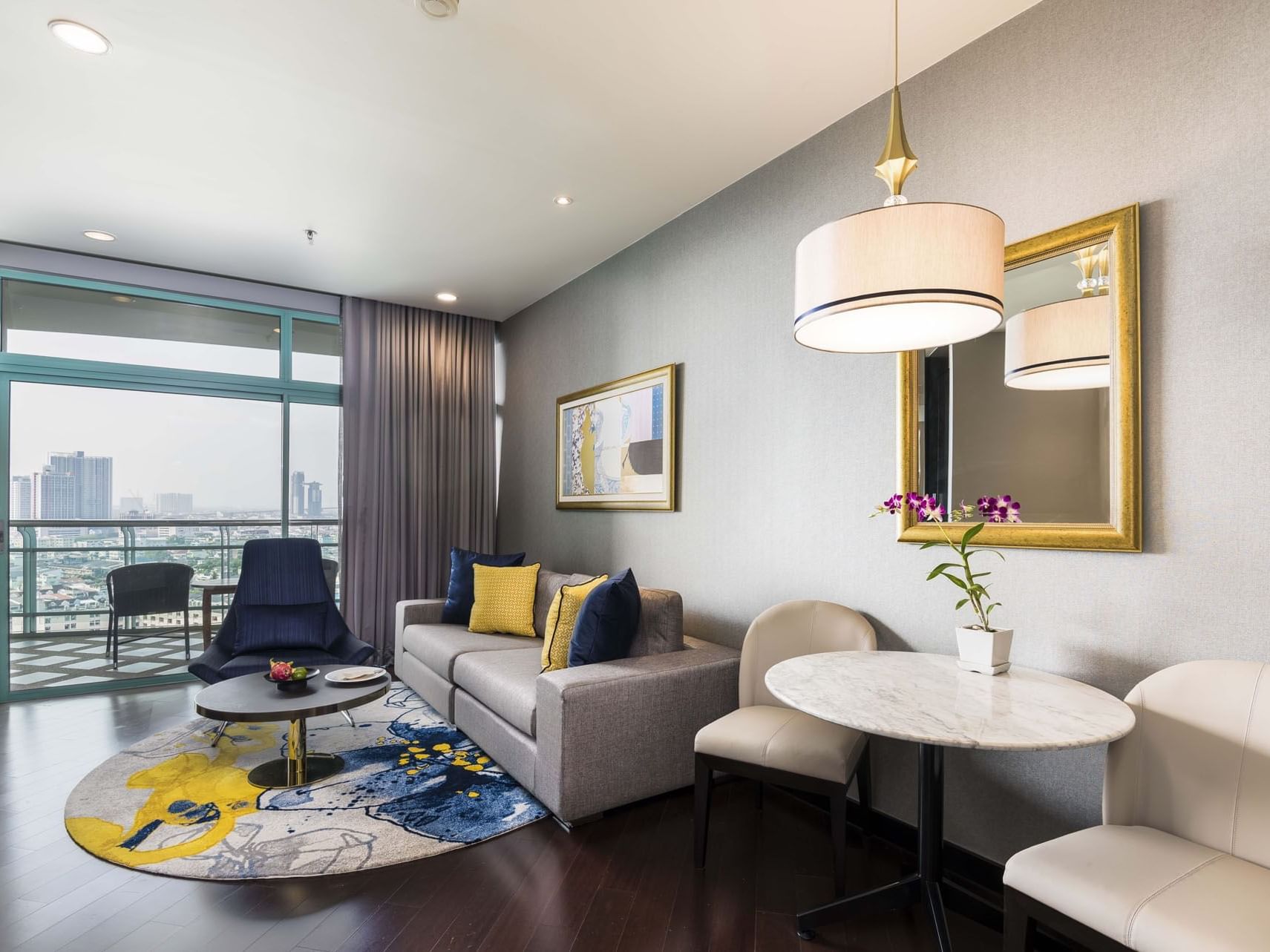 One Bedroom Suite City View living area at Chatrium Hotels