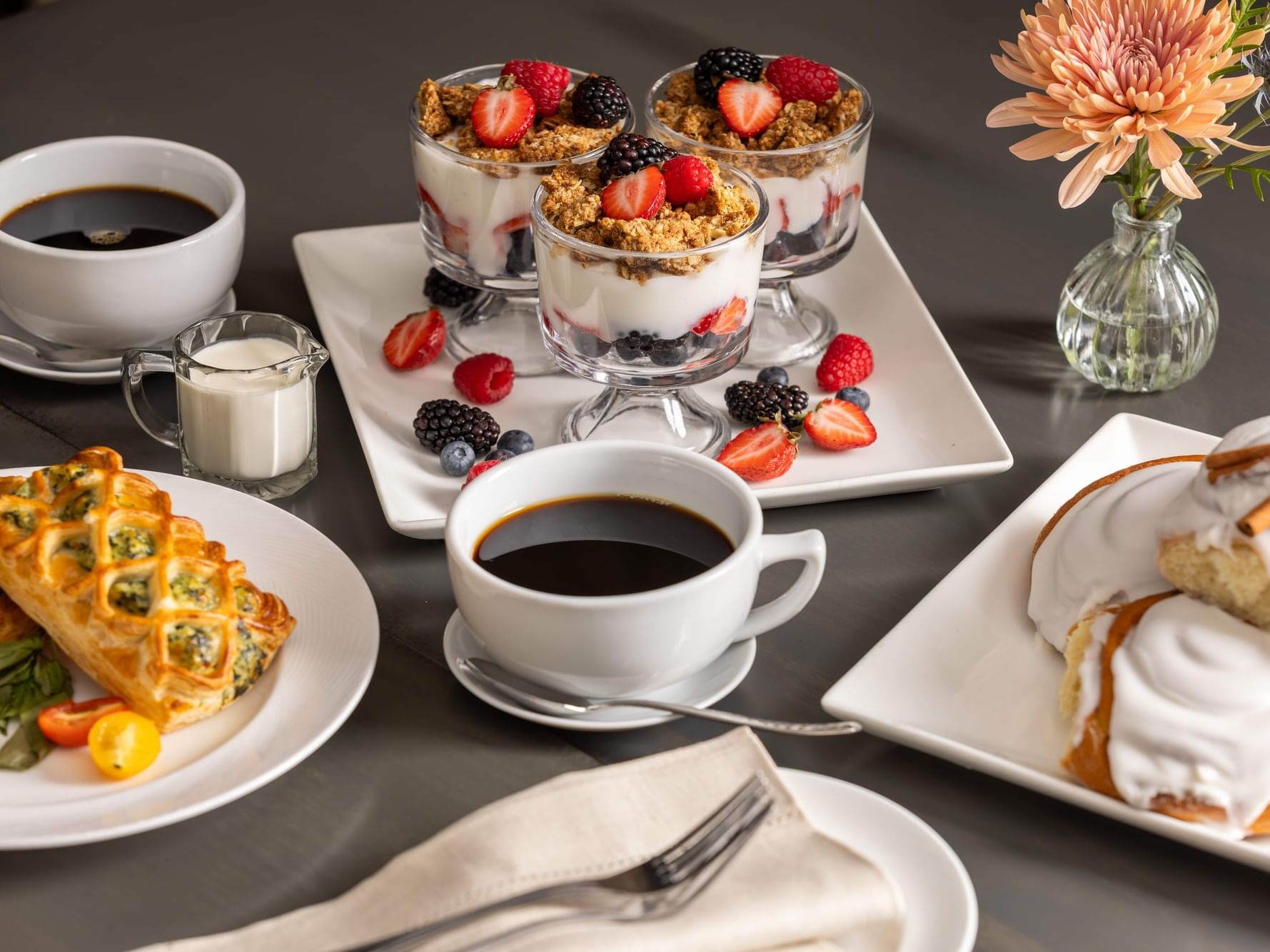 An assortment of sweet and savoury breakfast food and coffee at Monkey Grind Coffee Shop at Shangri-La Resort and Golf Club