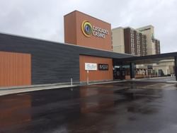 Motor lobby area & wet parking lot in Cascades Casino Chatham near Retro Suites Hotel