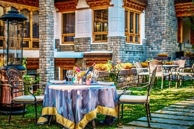 Outdoor dining area in The Orchard at The Indus Valley Leh, luxury hotel in Leh Ladakh