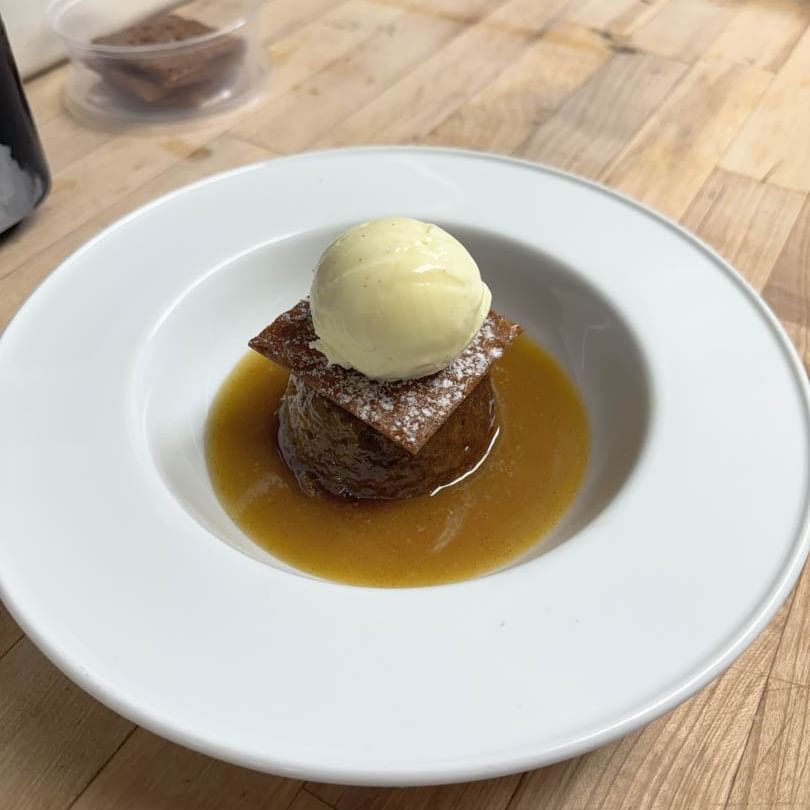 Close-up of Sticky toffee pudding served on a table at Stein Eriksen Lodge