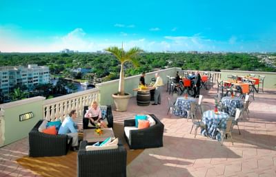 hotel terrace with lounge chairs and blue sky
