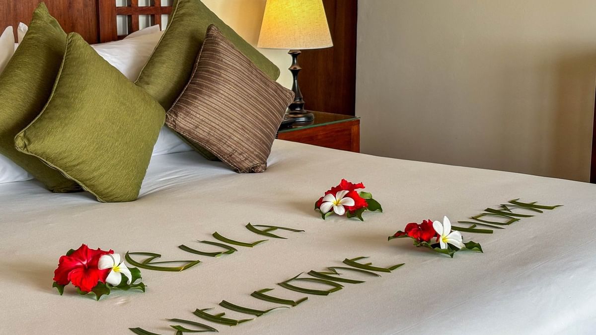 Welcoming floral arrangement on a bed at Studio Villa in Korolevu at The Naviti Resort Fiji.