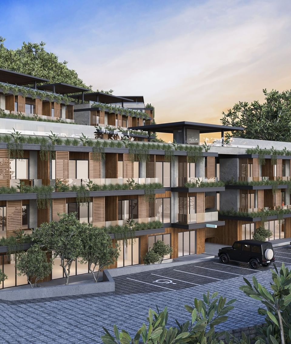 Modern BlueZone Residence with terraced floors, lush greenery, and a parking lot at A'ila Residences