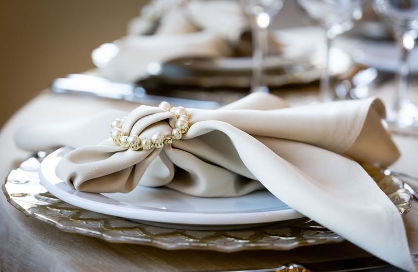 A table setting of a napkin on a plate at The Wildwood Hotel