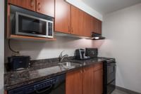Our full kitchens in our studio rooms include microwave, Keurig coffee machine, oven, dishwasher and more!