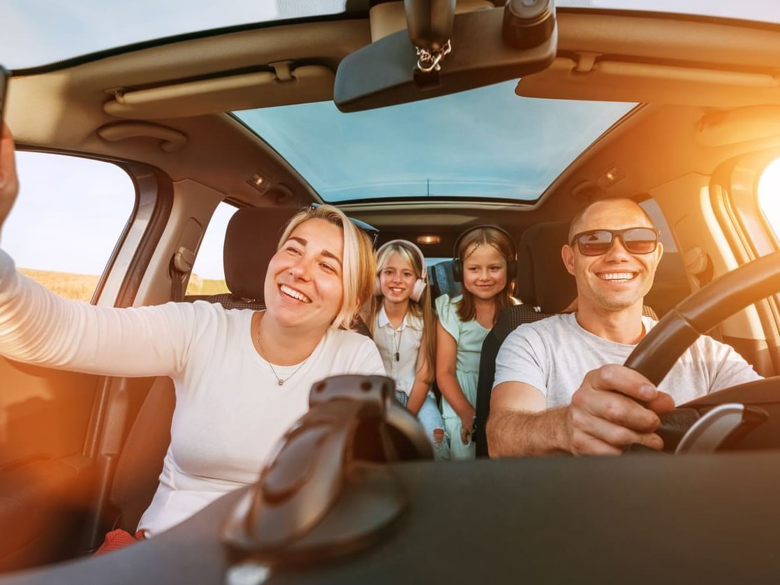 Dana Point Marina Inn Park & Play Package. Family in car driving
