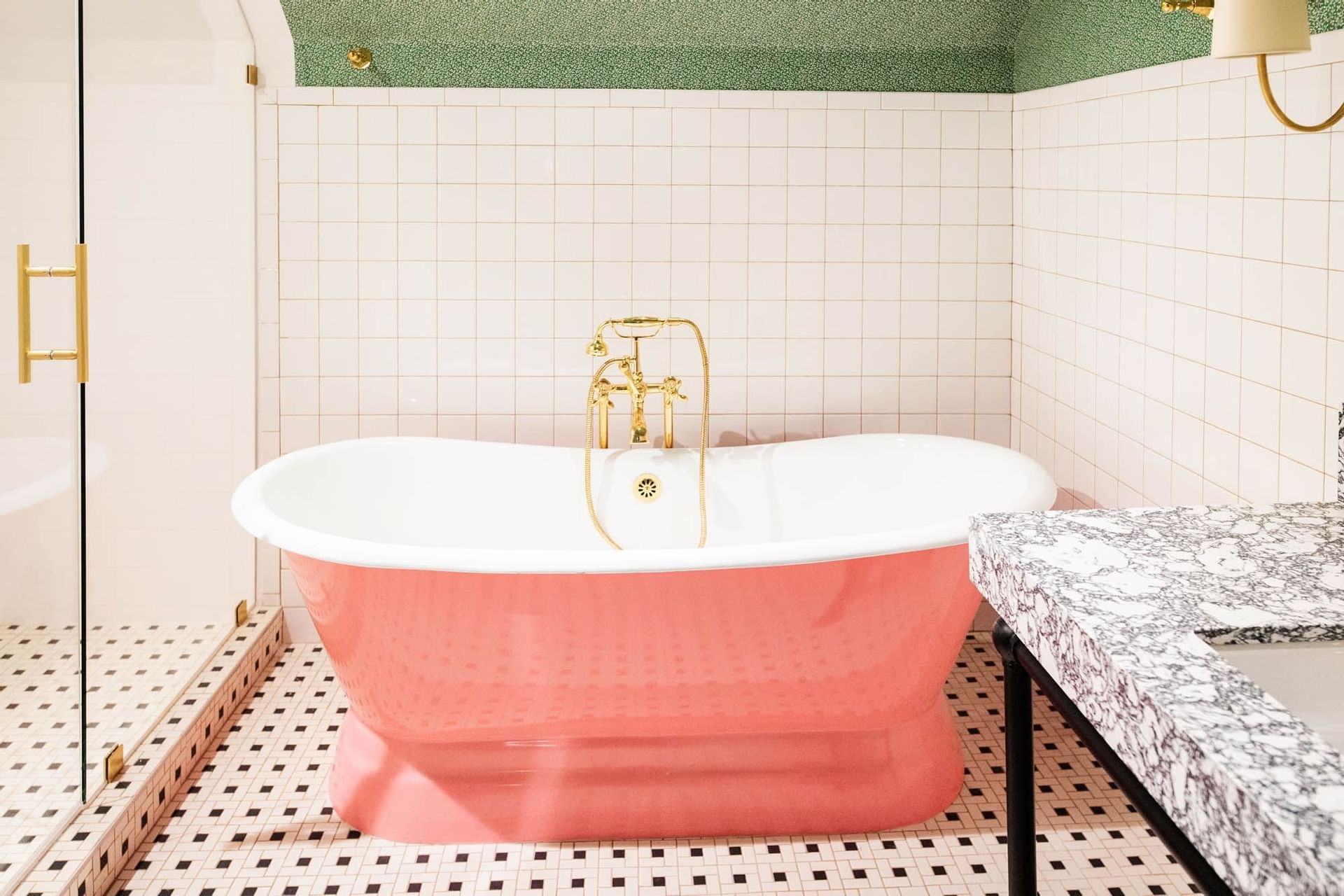 pink bathtub in boutique bathroom