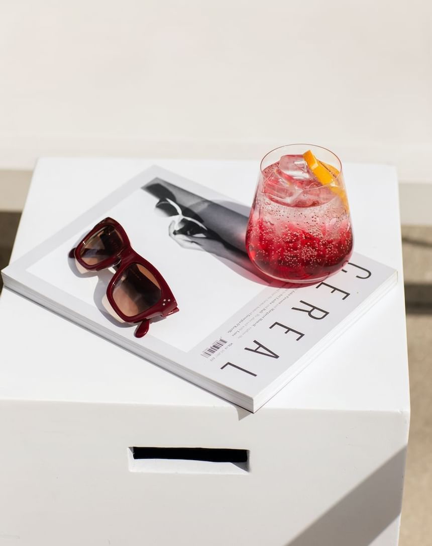 A cocktail served with a magazine at Luxe Sunset Boulevard