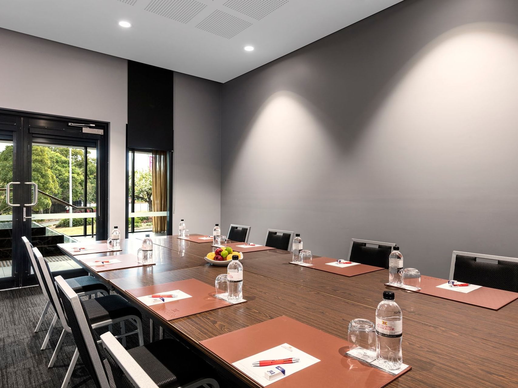 Boardroom table with a bowl of fruit in Chancellor 7 at Hotel Grand Chancellor Brisbane