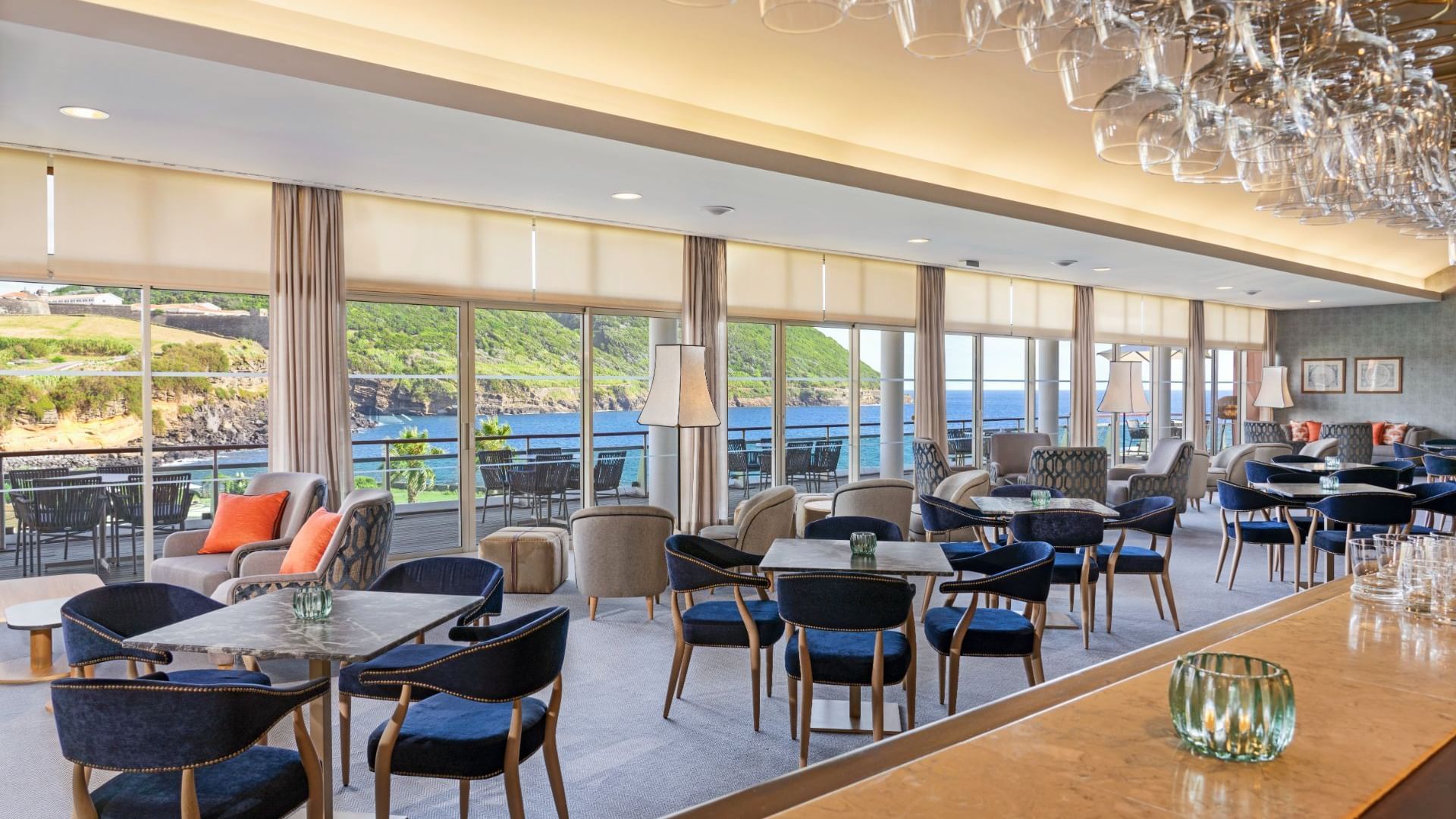 Dining tables by the counter area with a sea view in Fanal bar at Terceira Mar Hotel