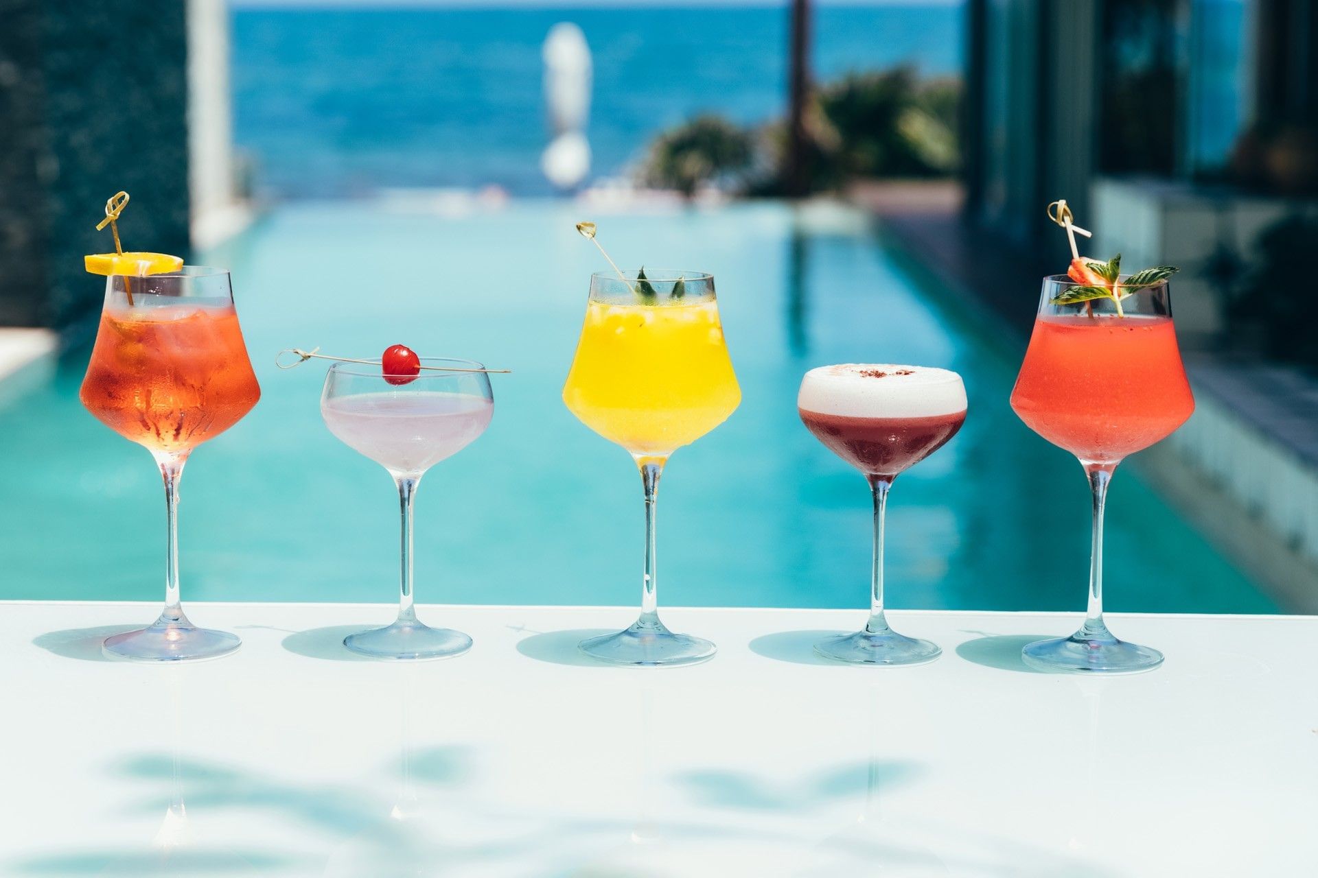 Colorful cocktails beside Mi Amor's infinity pool in Tulum