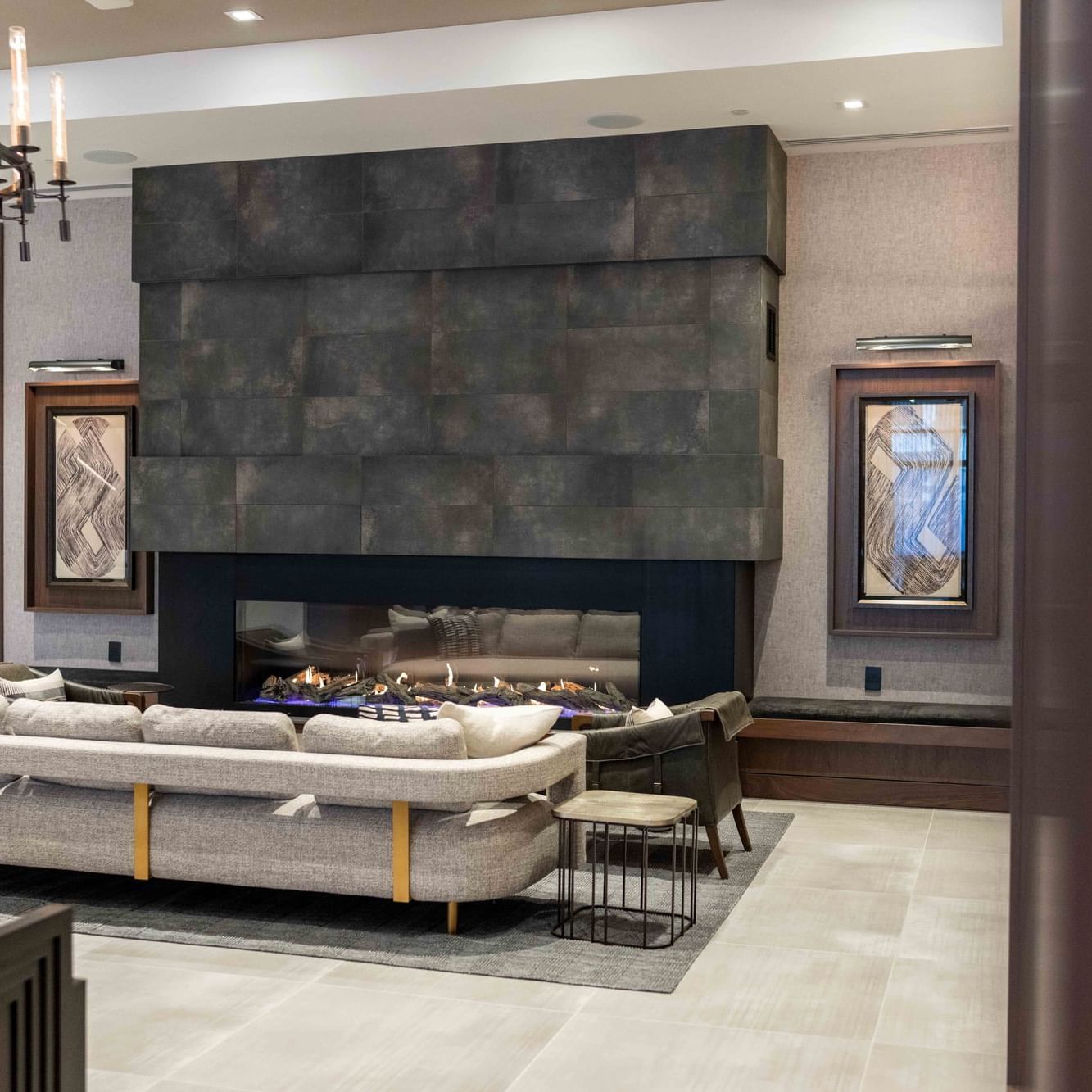 Indoor restaurant lounge area by a firepit at The Artisan Hotel at Tuscan Village