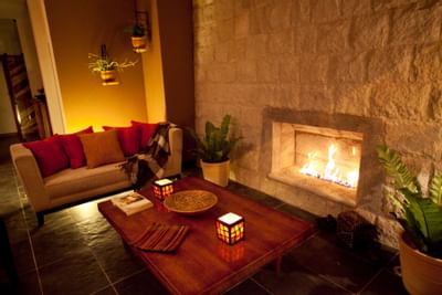 sofa and coffee table next to fireplace
