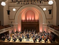 A western music band is playing instruments in Cadogan hall at Sloane Square Hotel