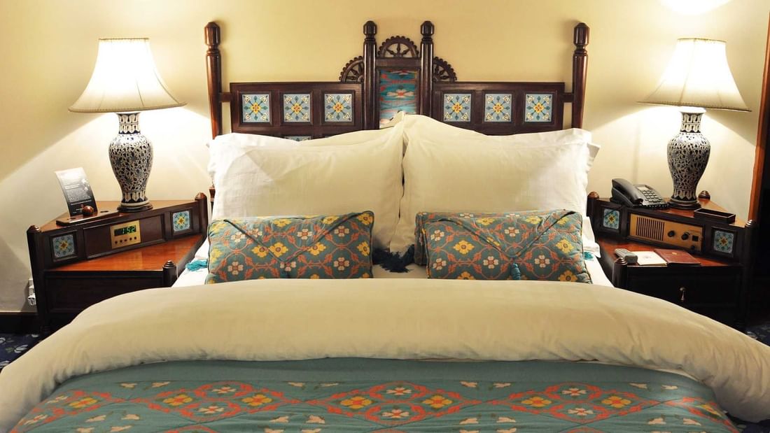 Queen bed in The Deluxe Room at Faisalabad Serena Hotel