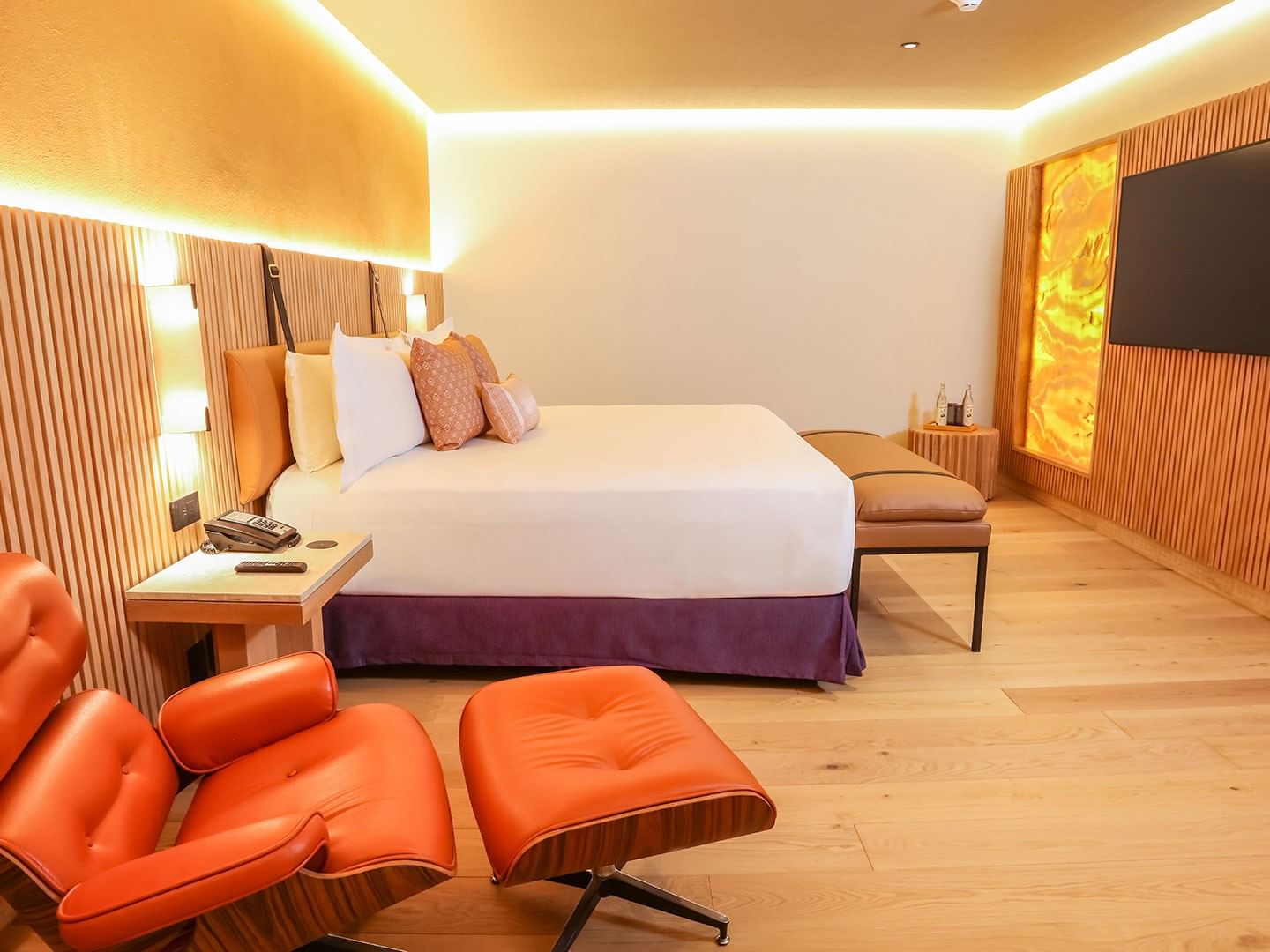 King Superior Junior Suite with a large bed, lounge chairs, and modern decor at Camino Real Polanco Mexico, Ciudad de Mexico.
