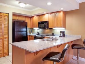 Kitchen in One & Two Bedroom Deluxe at Legacy Vacation Resorts