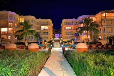 Night Photo of Pool and building at Windsong Resort On The Reef