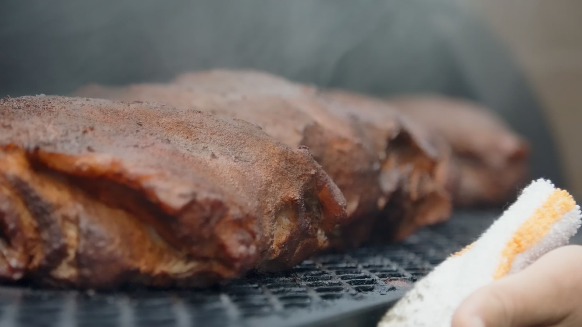 Close-up of grilled meat served  in Bark ‘N Brine at Camp Creek Inn