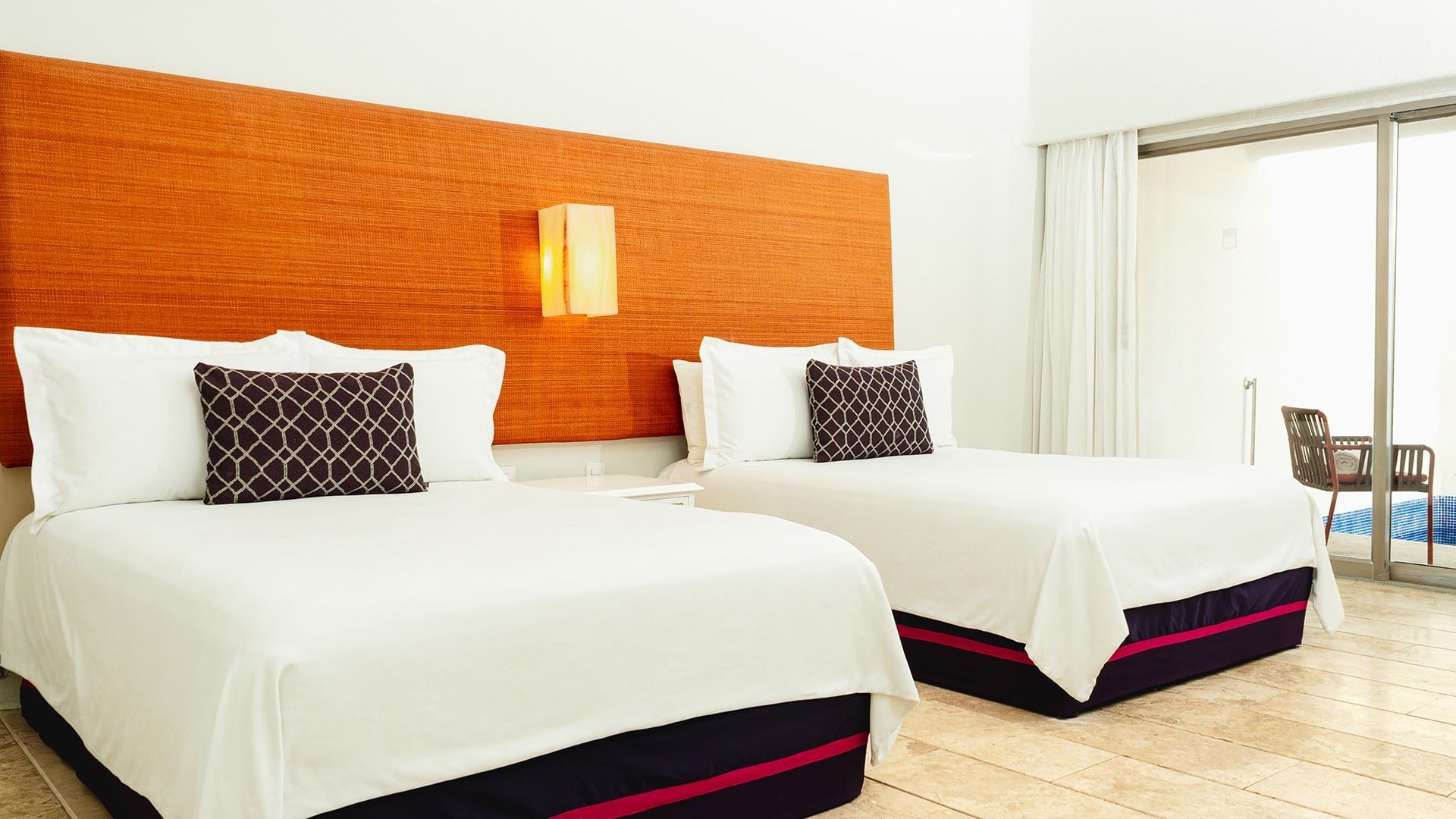 Nightstand by the beds with cushioned headboard & wooden floors in 2 Double Camino Real Club at Camino Real Zaashila Huatulco