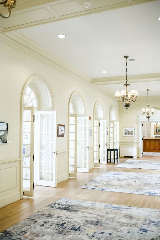 Interior of a hallway with arched windows at Exeter Inn