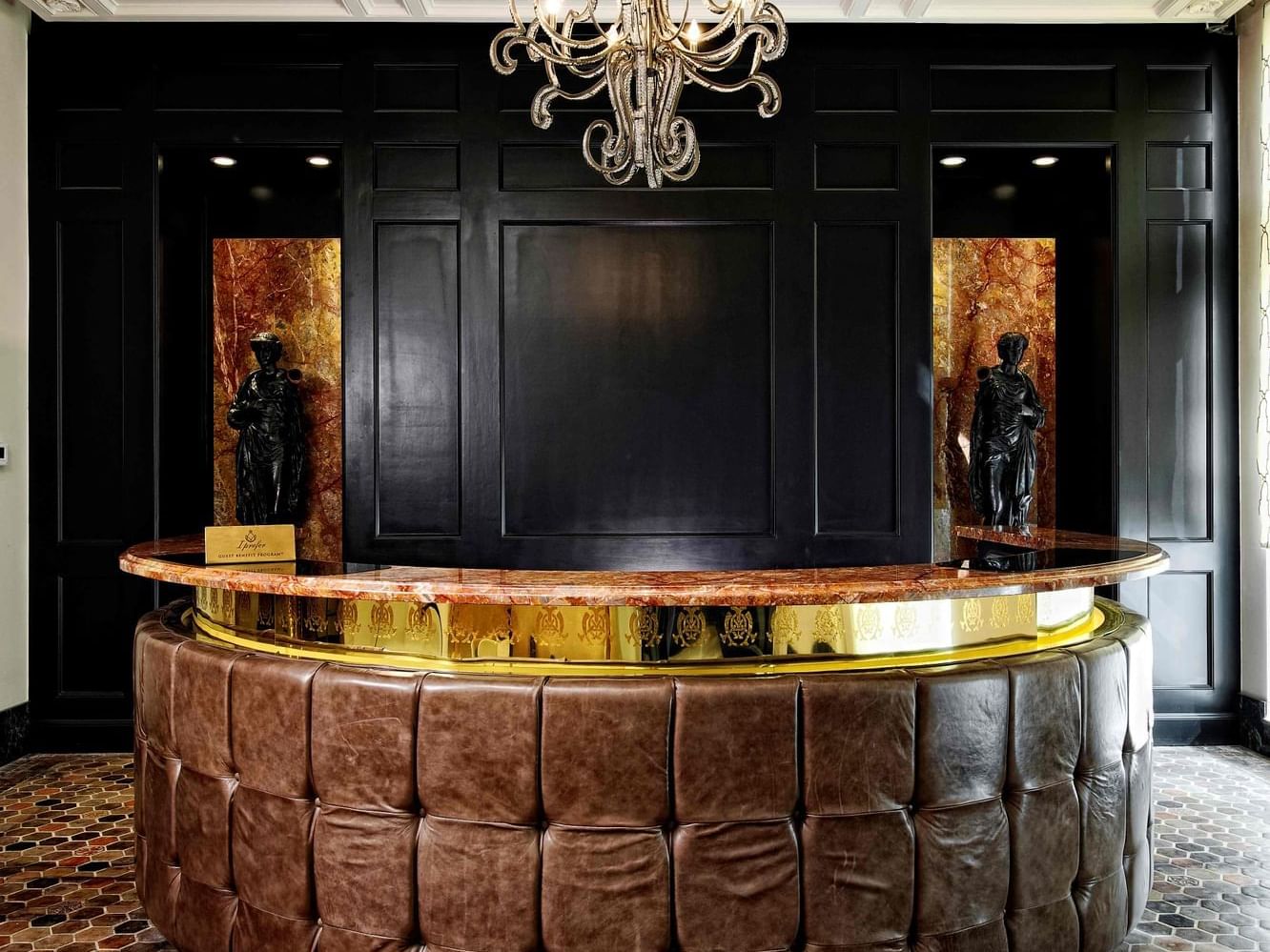 Close-up of the front desk with Chandelier at The Mayo Hotel