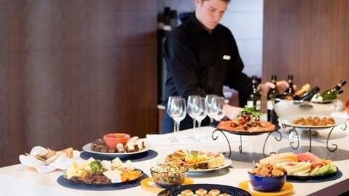 A chef is preparing a dining table at Pullman Sydney Hyde Park