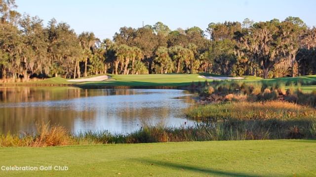 Golf course with a water hazard near Lake Buena Vista Resort Village & Spa