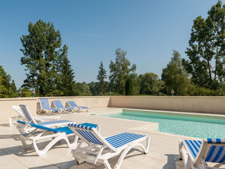 Sunbeds by the outdoor pool at Domiane de Presle Saumur