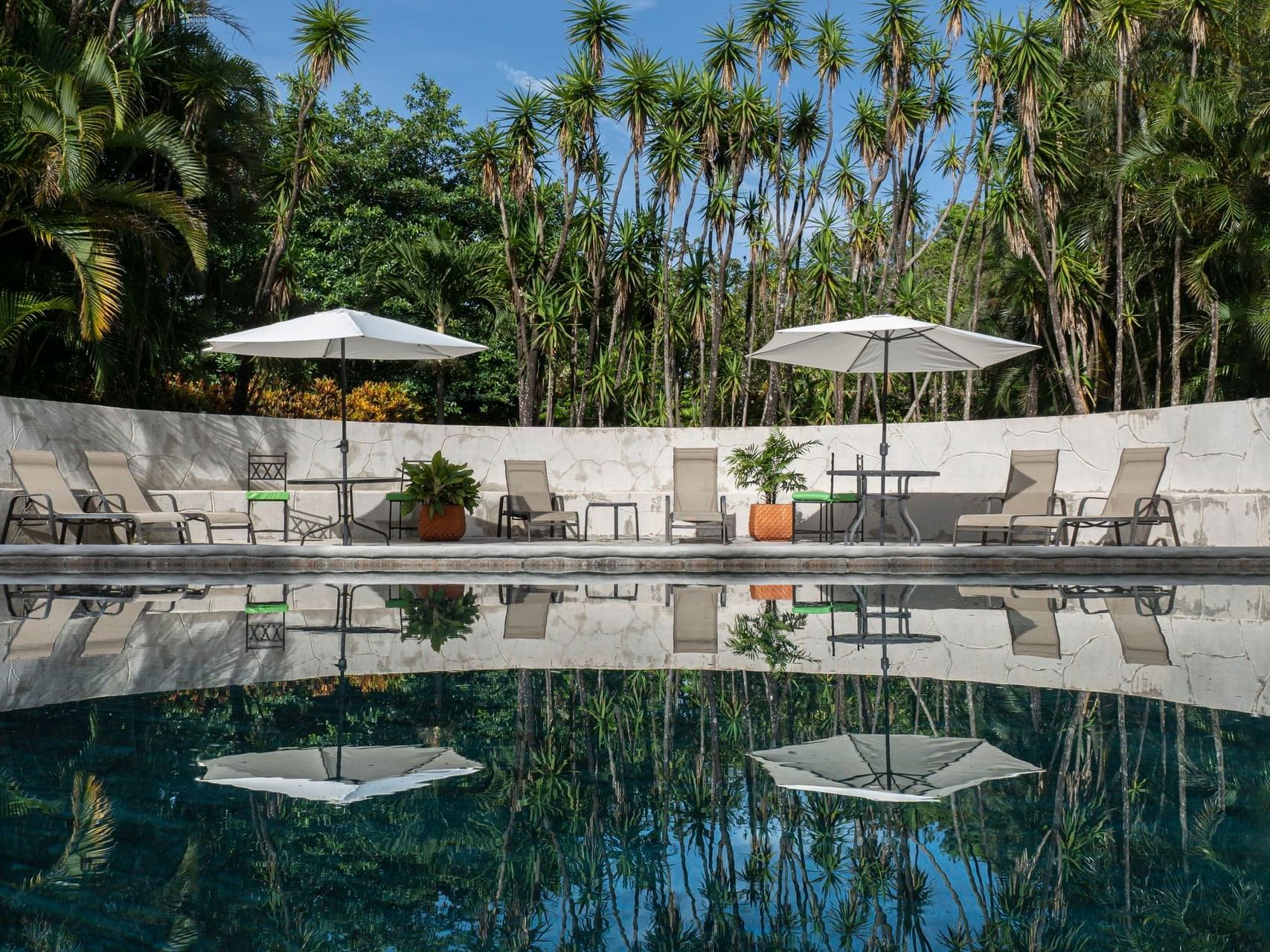 Outdoor pool with sun loungers at Buena Vista Del Rincon