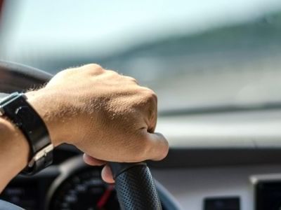 Close-up of hand on steering wheel, James Cook Grand Chancellor