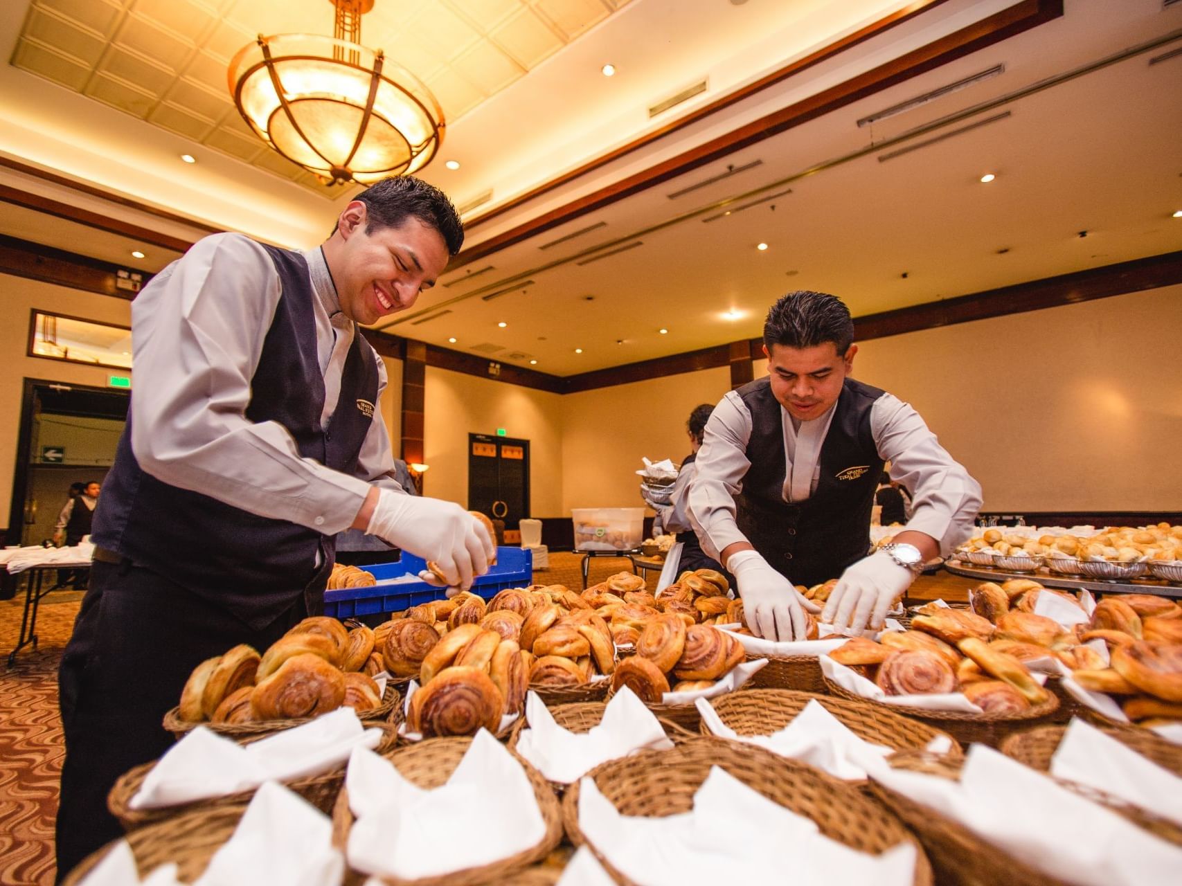 Chefs arranging snacks in Tikal III Room at Tikal Futura Hotel