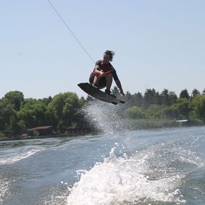 A man on water skiing near Falkensteiner Hotels