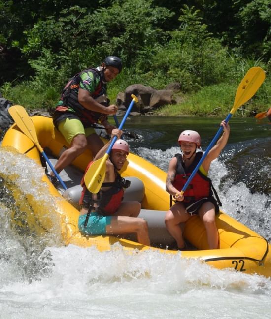 People enjoying rafting on a river near Villas Sol Beach Resort