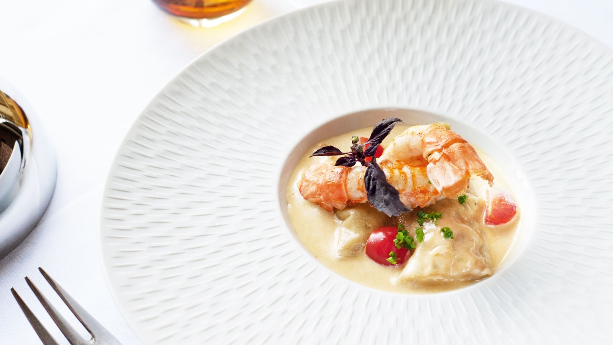 Closeup of a well-plated dish served at Originals Hotels