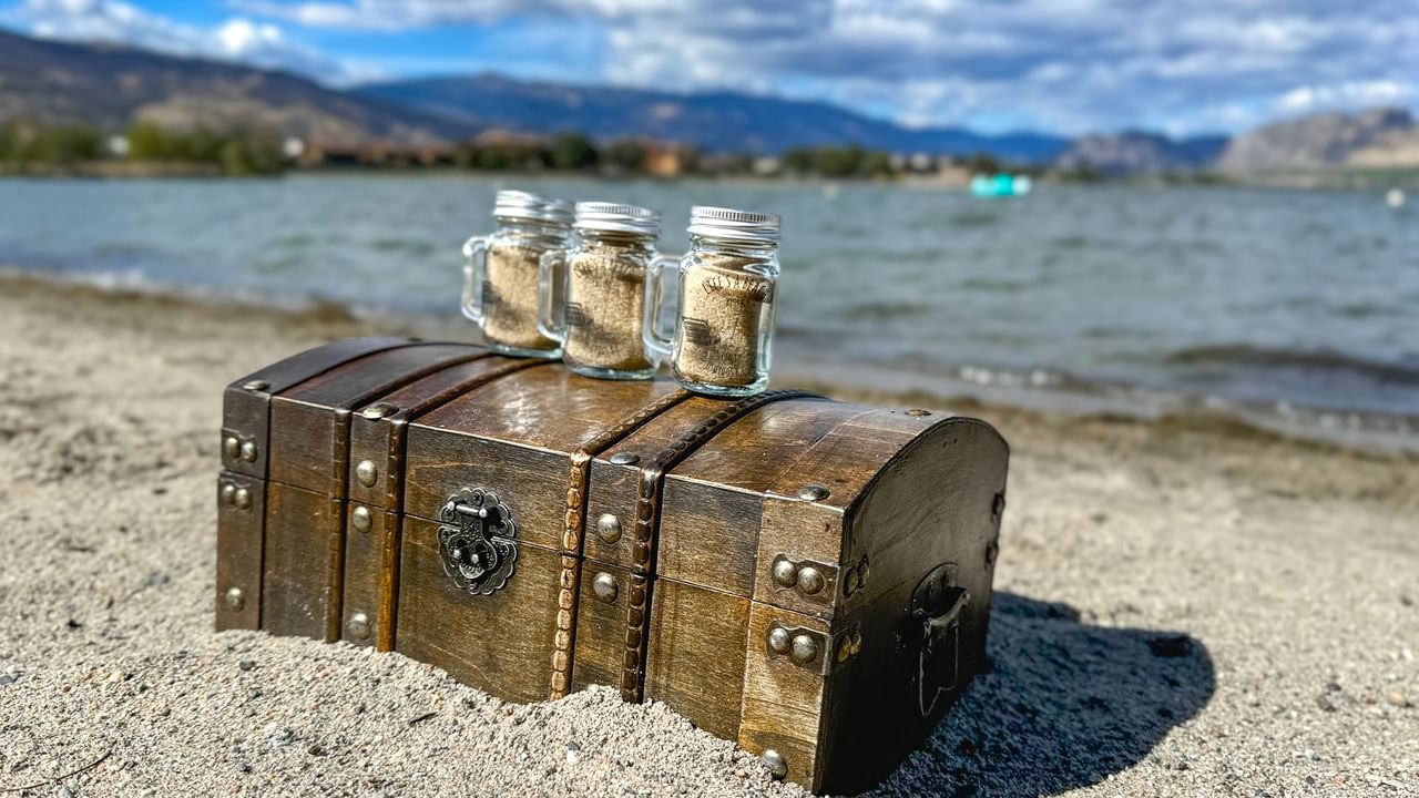 Mason jars filled with sand and a wooden box
