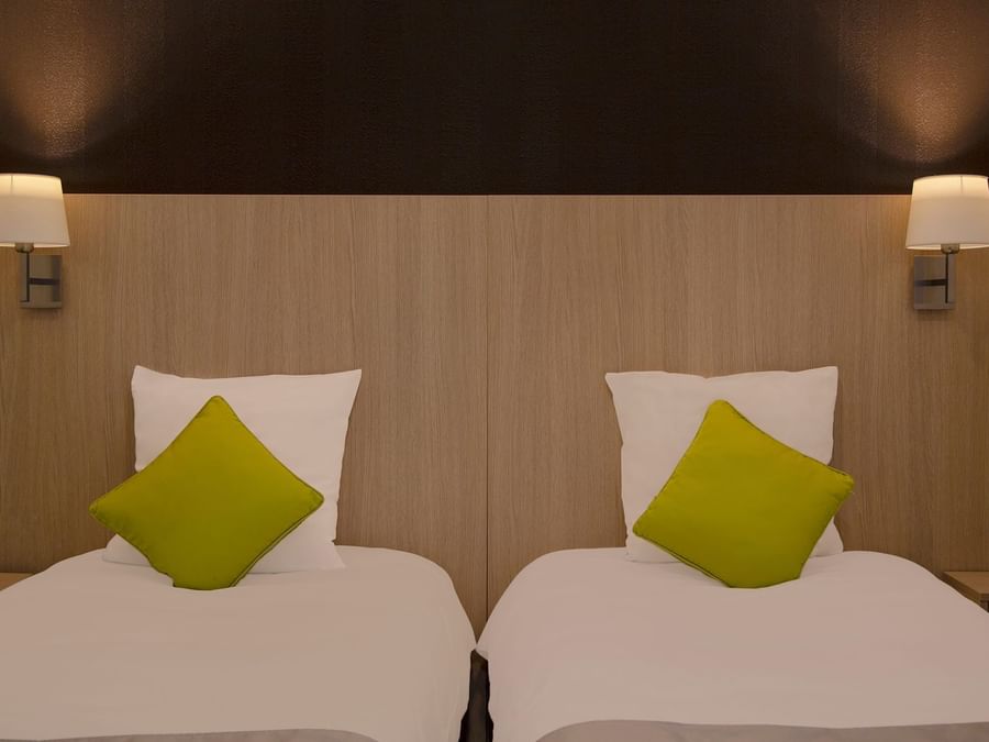 Twin beds in Le Clos de I'Orgerie at The Original Hotels
