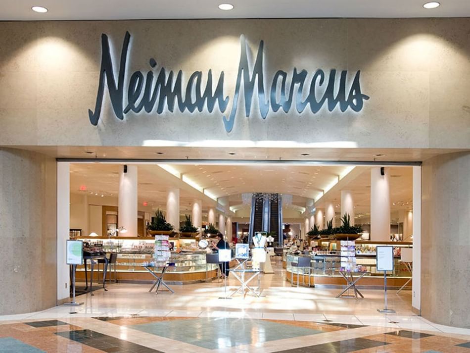Entrance to Neiman Marcus near Granduca Houston, featuring luxury goods and elegant interior design