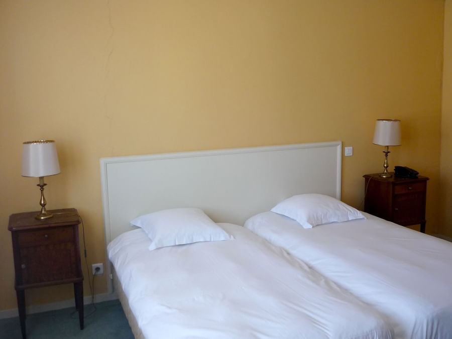 Double beds in superior twin room at The Originals Hotels
