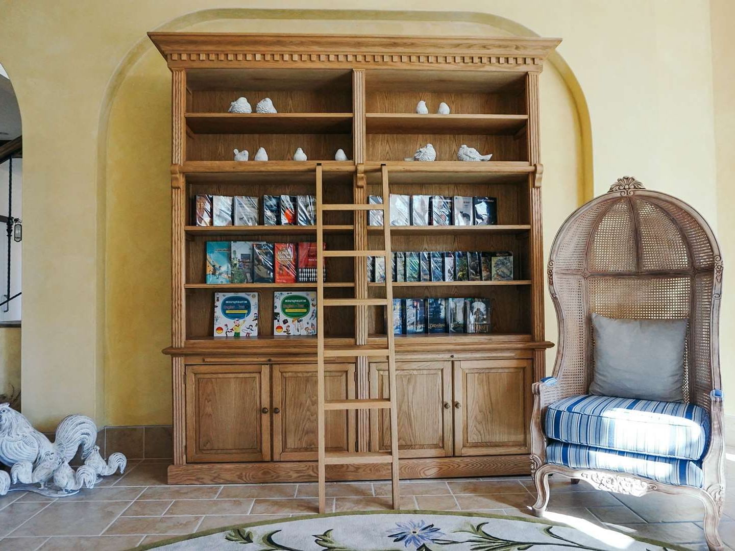 Cupboard with many books in library at U Hotels and Resorts