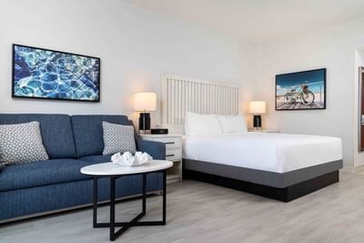 A Guest Room with a blue couch at Ocean Place Resort & Spa